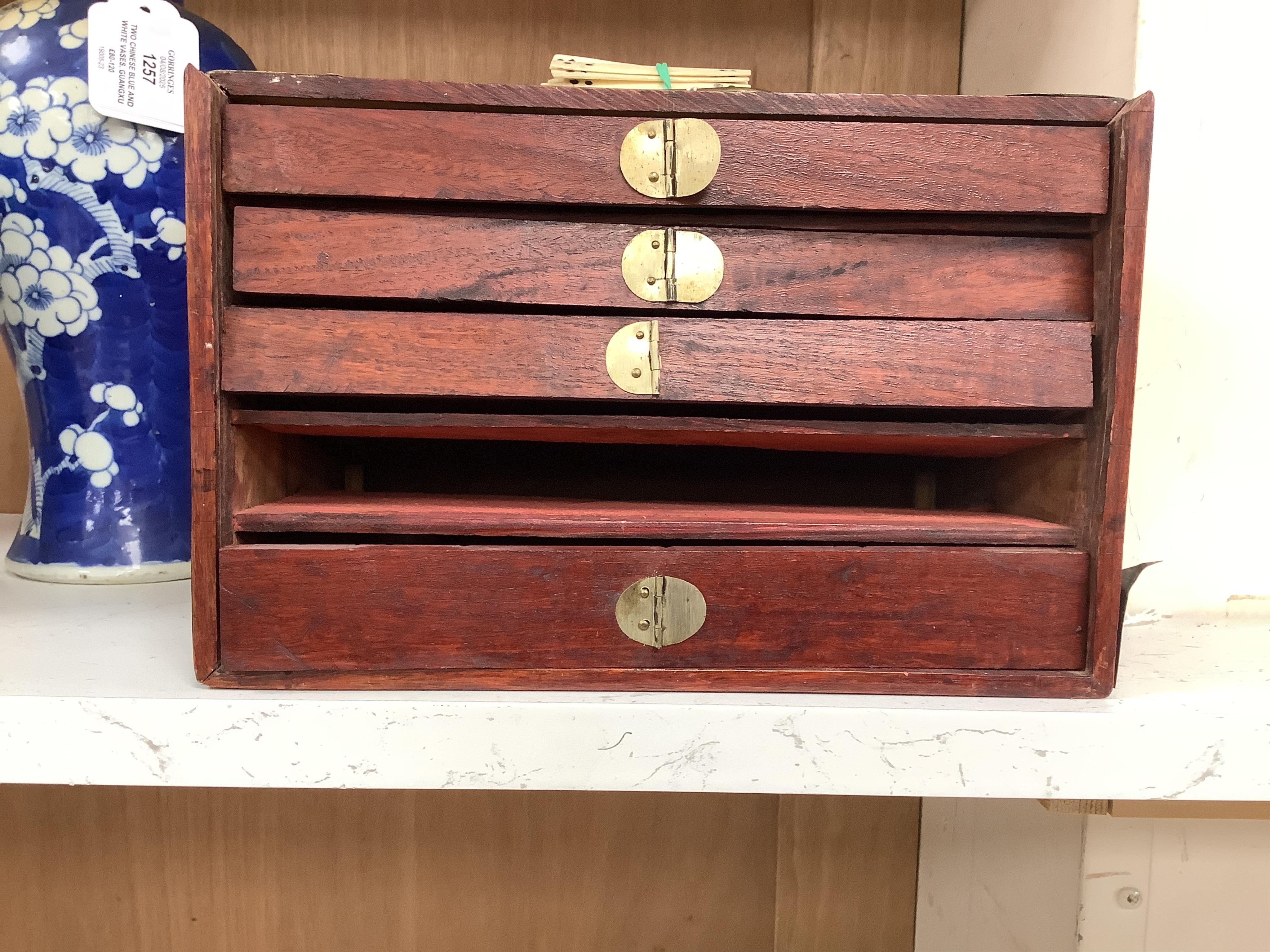 A cased Chinese mahjong set, bone pieces